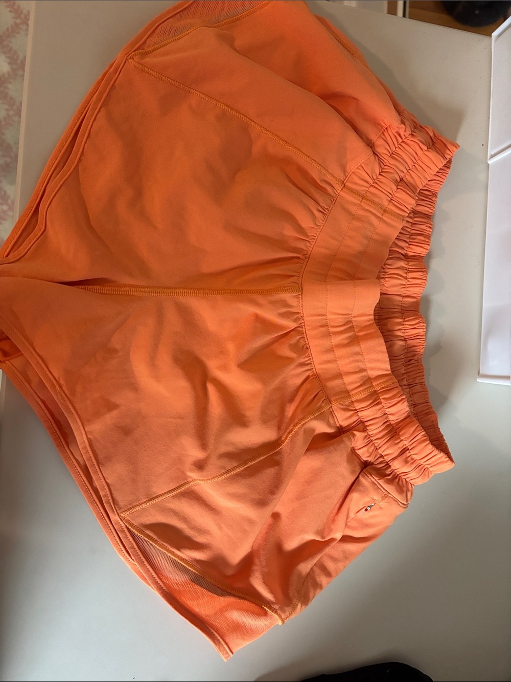 Women’s Lululemon 2.5 low rise hotty hot shorts in orange soda